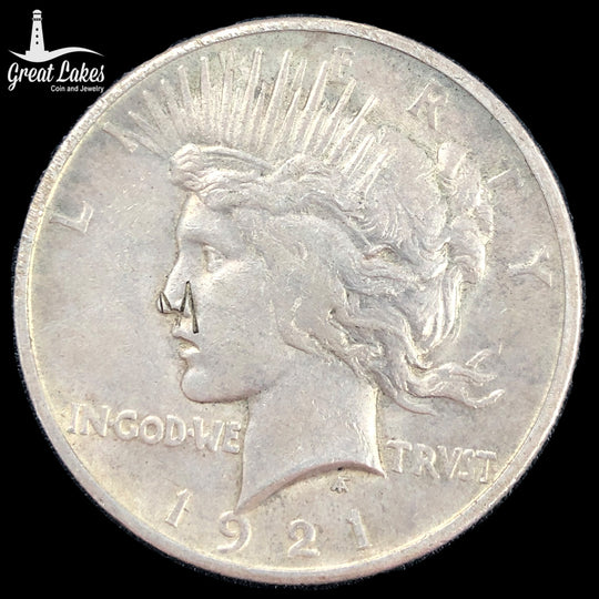 1921 Peace Silver Dollar Counterstamped “M” (VF)